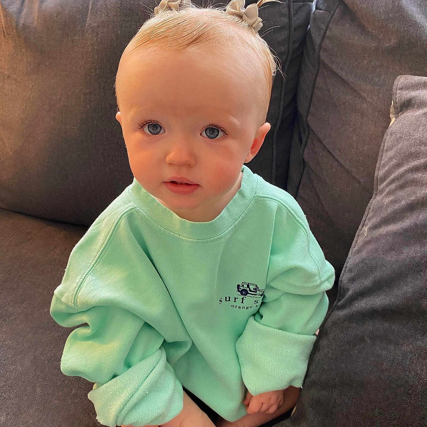 Niylah is registered to the contest to win money with this photo: baby, baby_toddler_clothing, cheek, child, comfort, cool, couch, dress, eye, face, finger, gesture, happy, head, neck, outerwear, skin, sleeve, smile, toddler