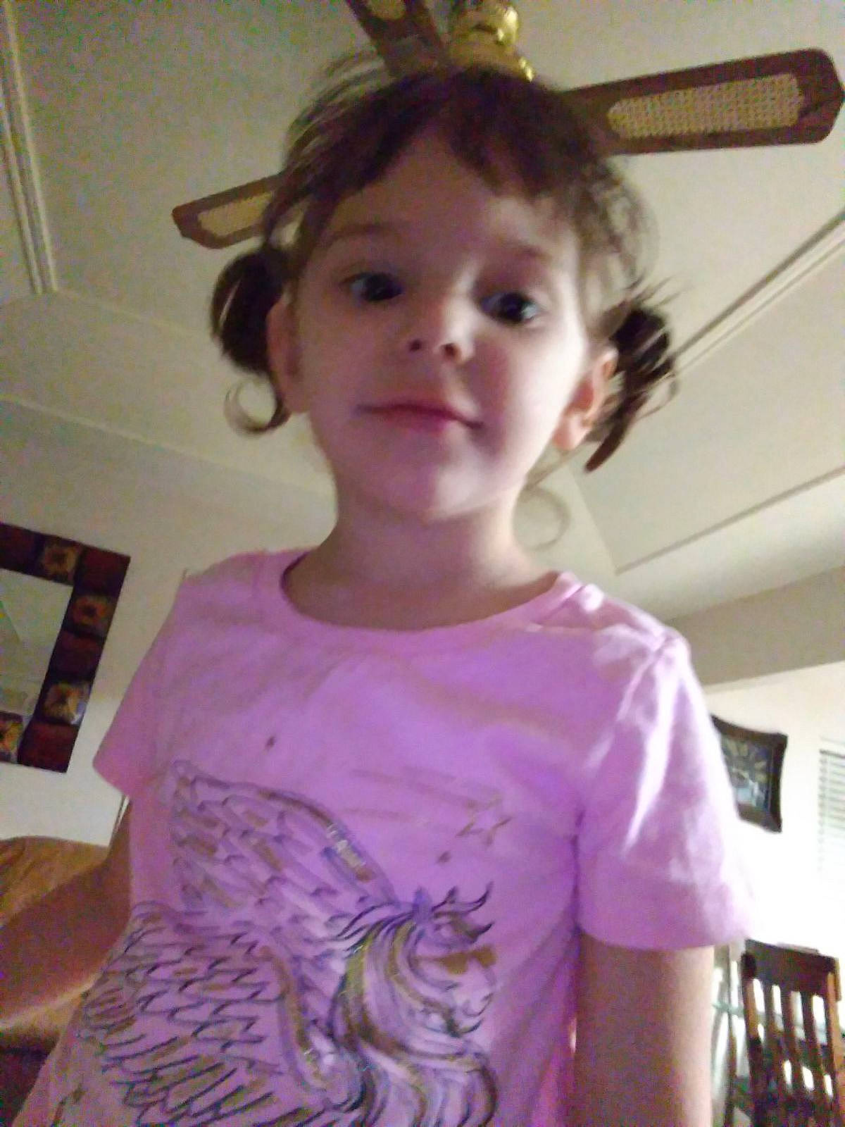 Sadie is registered to the contest to win money with this photo: cheek, cool, ear, eyelash, hairstyle, happy, iris, long_hair, mouth, neck, nose, organ, person, pink, shoulder, skin, sleeve, smile, standing, t_shirt