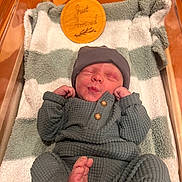 Woodson joined the competition — help win amazing prizes! newborn, baby, infant, sleeping, hat, clothing, blanket, crib, wood, pajamas, foot, hand, face, button, plush, soft, cozy, indoor, portrait, resting