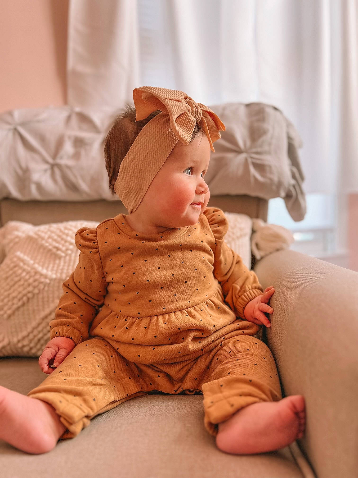 Oakley Rae is registered to the contest to win money with this photo: baby, baby_sleeping, baby_toddler_clothing, beige, cheek, comfort, eye, flooring, headgear, headwear, human_leg, linens, orange, peach, person, sitting, skin, sleeve, textile, toddler