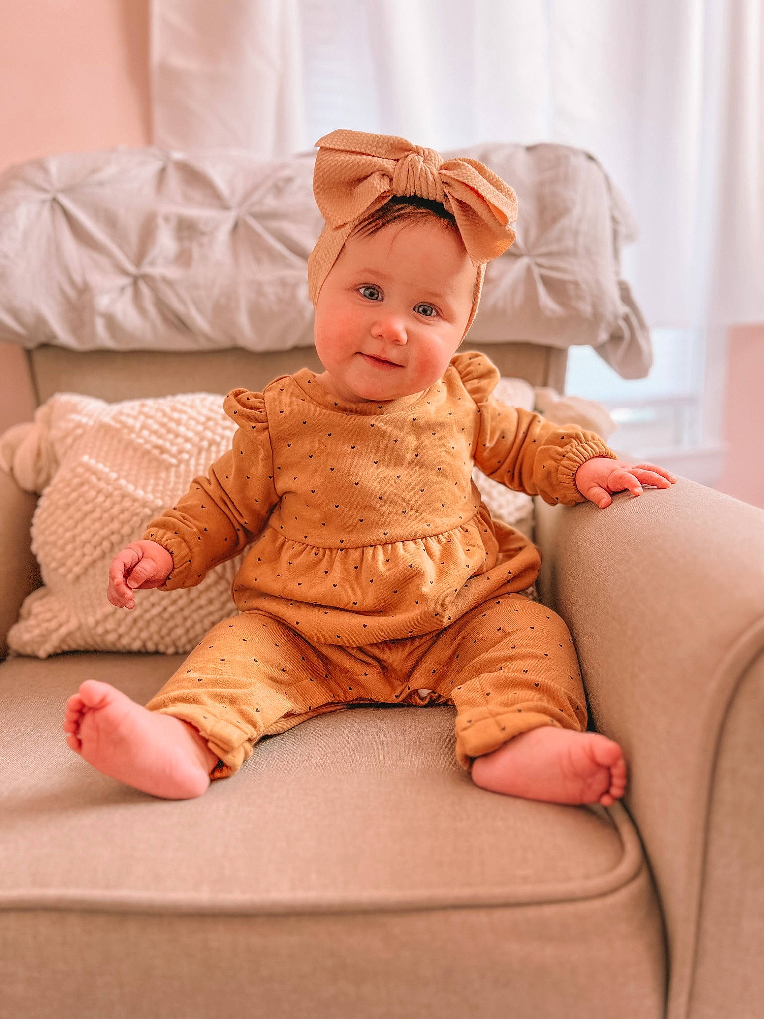 Oakley Rae joined the competition — help win amazing prizes! arm, baby, baby_toddler_clothing, cheek, child, comfort, dress, flooring, foot, fur, happy, headwear, human_leg, joy, peach, person, pink, sitting, skin, sleeve