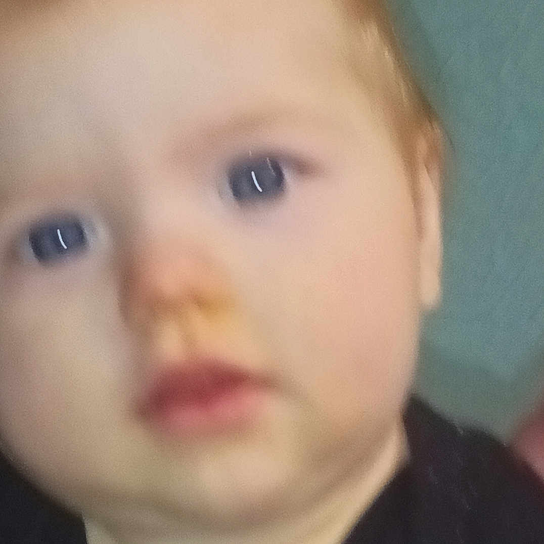 Malachi Brown is registered to the contest to win money with this photo: baby, blue_eyes, blurry, child, close_up, clothing, cute, expressionless, face, head, human, indoor, infant, person, portrait, red_hair, skin, soft_focus, young, young_child
