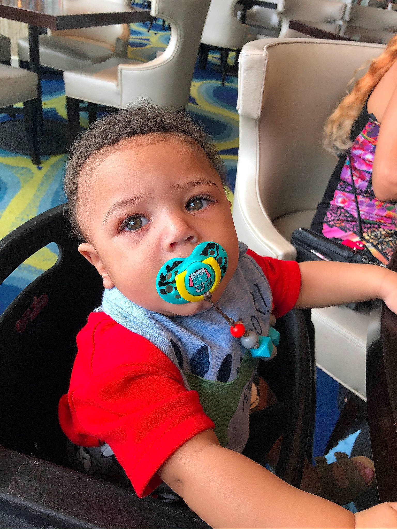 Lumine is registered to the contest to win money with this photo: auto_part, car_seat, child, person, steering_wheel, toddler