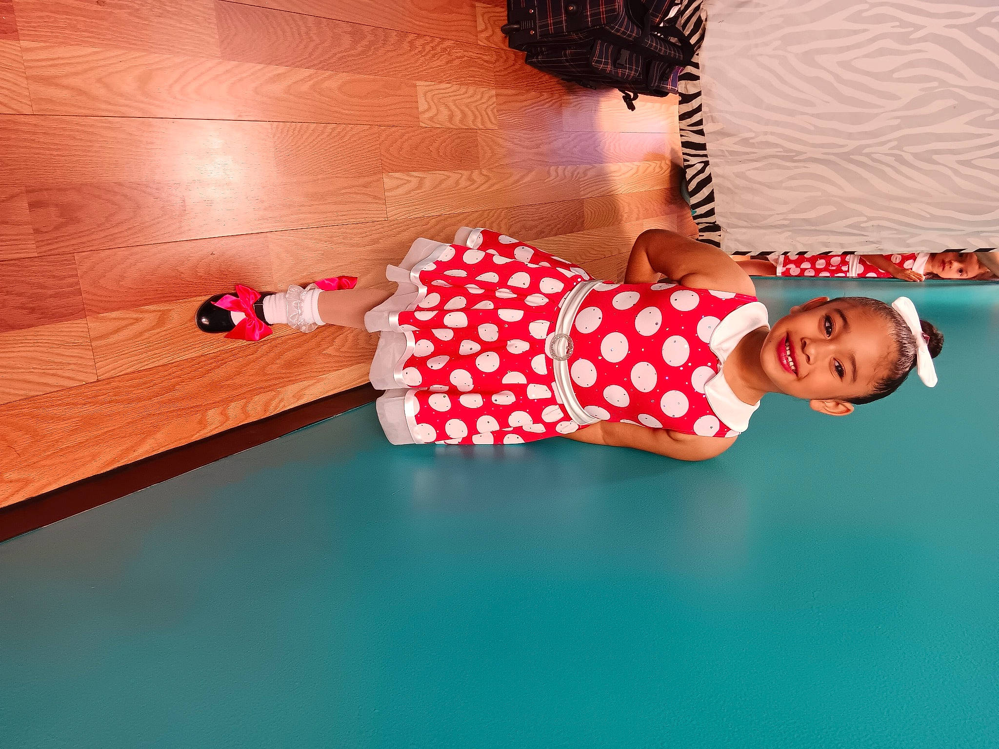 Nevaeh is registered to the contest to win money with this photo: baby_toddler_clothing, child, comfort, elbow, flooring, happy, hardwood, human_leg, joy, knee, leisure, magenta, orange, pattern, person, pink, room, sleeve, thigh, tints_and_shades