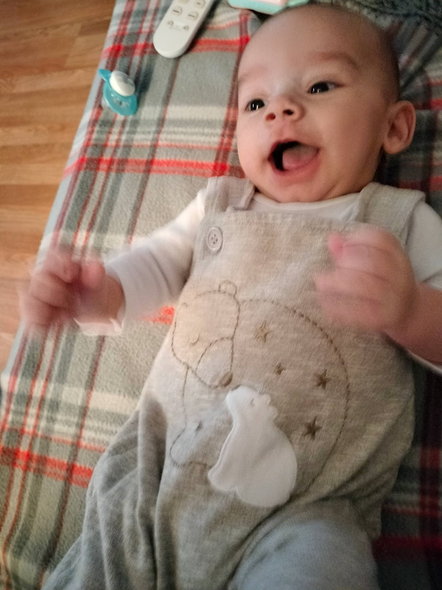 Jasper is registered to the contest to win money with this photo: baby, baby_laughing, baby_toddler_clothing, cheek, comfort, eye, face, finger, happy, head, lip, nose, person, plaid, skin, sleeve, smile, tartan, textile, toddler