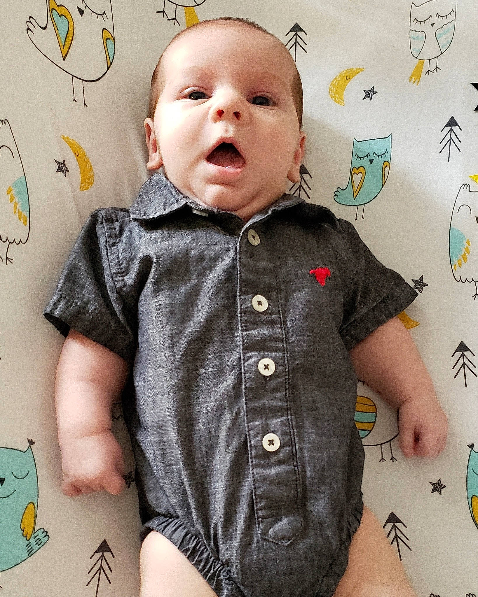 Eric Jr. is registered to the contest to win money with this photo: baby, baby_toddler_clothing, cheek, child, design, head, outerwear, pattern, person, product, shirt, sleeve, t_shirt, toddler, top