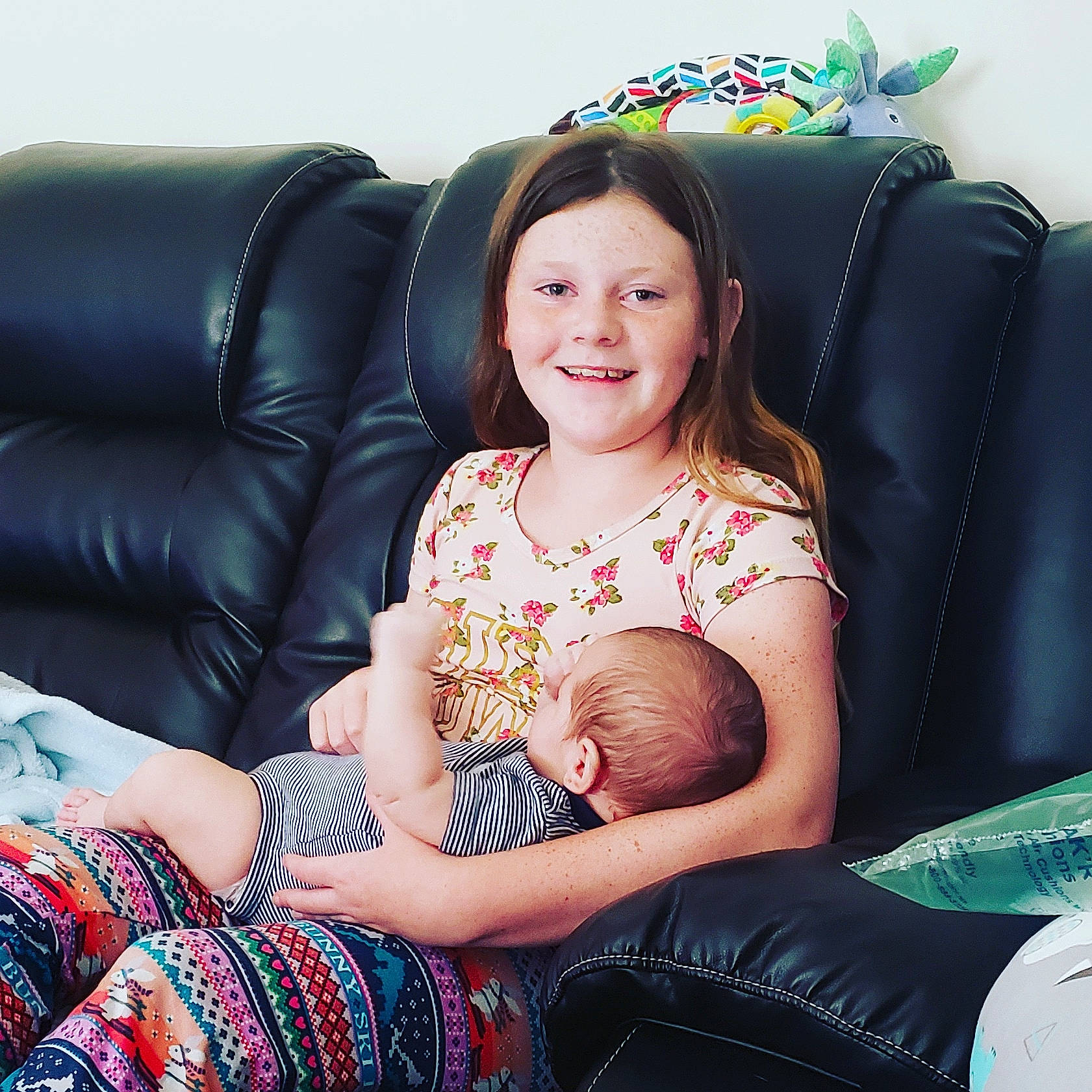 Eric Jr. is registered to the contest to win money with this photo: arm, baby, beauty, child, couch, design, furniture, joy, leg, pattern, people, person, photo_shoot, photography, sitting, skin, sleeve, smile, thigh, toddler