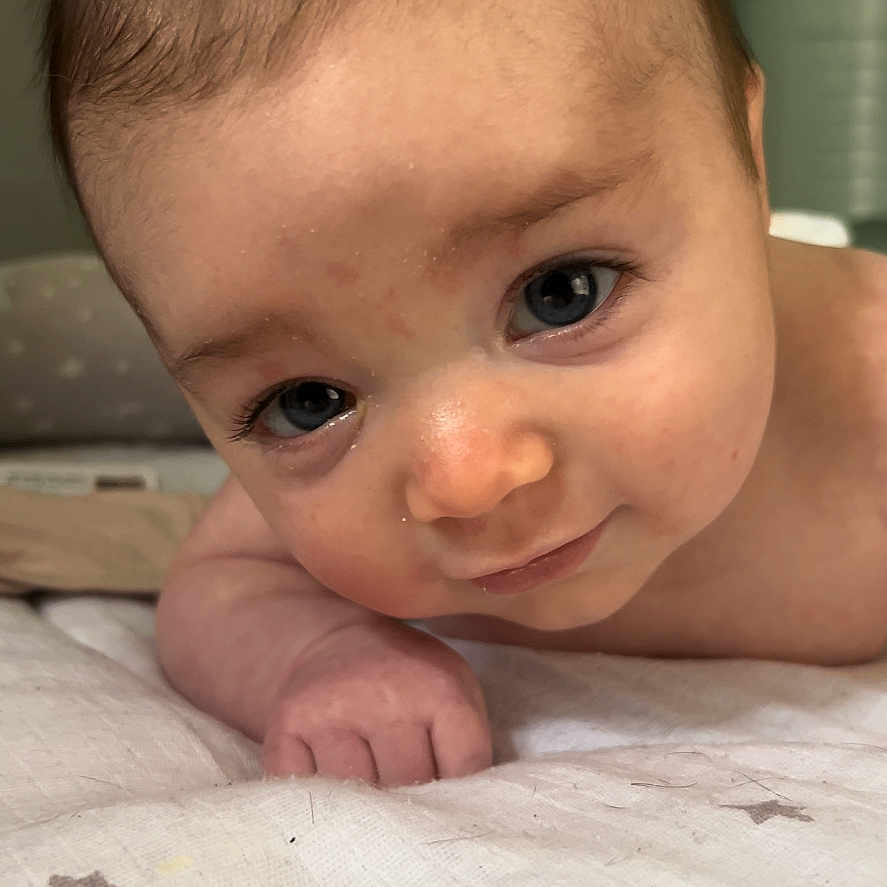 Sophia is registered to the contest to win money with this photo: baby, bodypart, face, finger, hand, happy, head, mouth, newborn, person, photography, portrait, smile