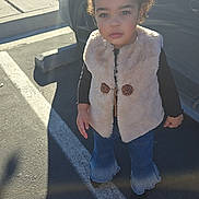 Saellem joined the competition — help win amazing prizes! car, casual, child, clothing, curly_hair, cute, daylight, fashion, jeans, outdoor, parking_lot, person, serious_expression, shadow, shoes, sidewalk, standing, sunlight, toddler, vest