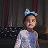 blanket, blue_bow, child, couch, cozy, curtains, cute, decor, dim_lighting, expression, furniture, home, indoor, pajamas, person, portrait, sleepwear, standing, unicorn_pattern, young_girl
