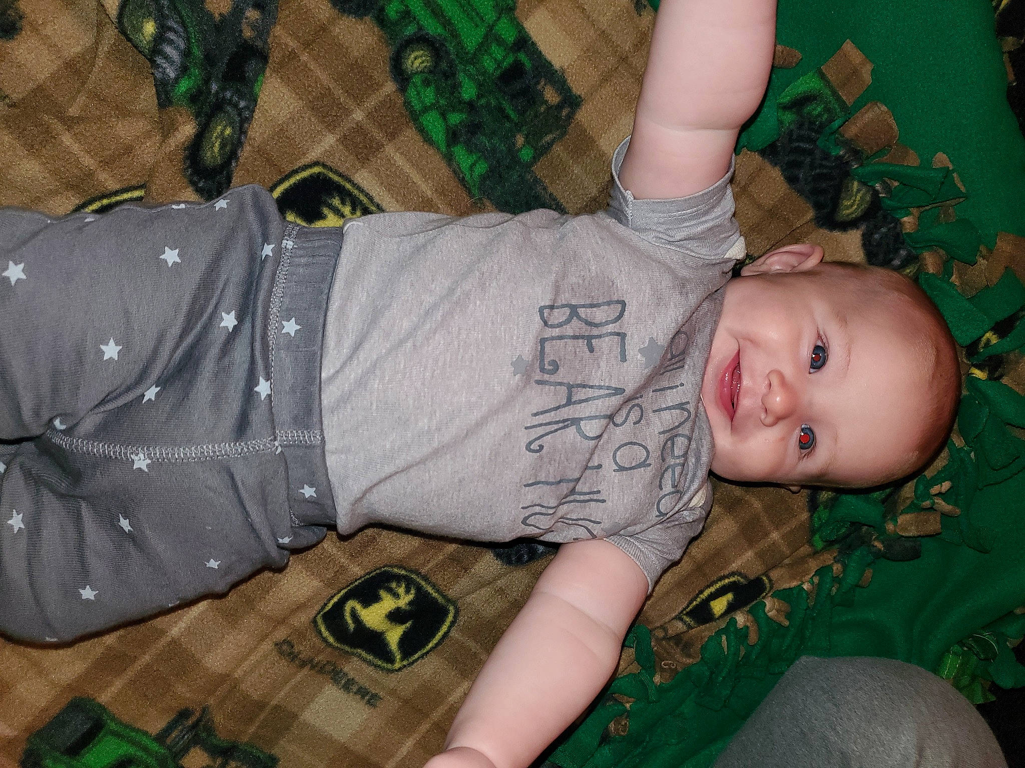 Bo joined the competition — help win amazing prizes! baby, child, flash_photography, flooring, fun, grass, green, happy, joy, lap, pattern, person, plaid, room, sitting, smile, t_shirt, thigh, toddler, tree