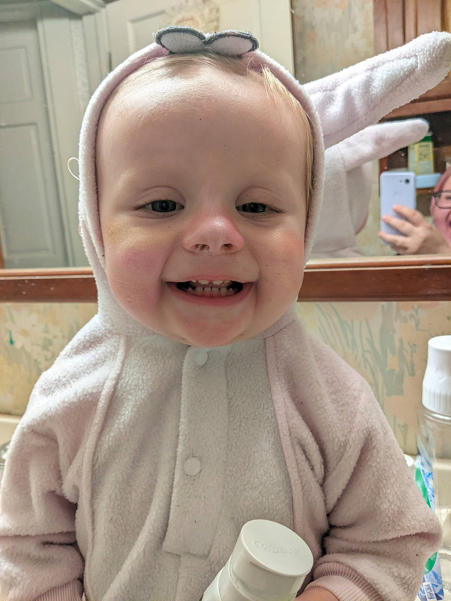 Nancy is registered to the contest to win money with this photo: baby, baby_toddler_clothing, cheek, child, door, drinkware, ear, eyelash, fun, gesture, happy, iris, joy, lip, mouth, nose, person, skin, sleeve, smile