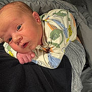 Kasen joined the competition — help win amazing prizes! baby, bed, blanket, closeup, clothing, cute, eyes, face, hand, head, human, indoors, infant, onesie, person, resting, skin, sleepwear, toddler, young