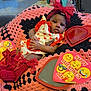 Demauri is registered to the contest to win money with this photo: baby, blanket, cap, clothing, couch, cream, cushion, dessert, face, food, furniture, hat, head, homedecor, person, photography, portrait, sitting, t_shirt, toy
