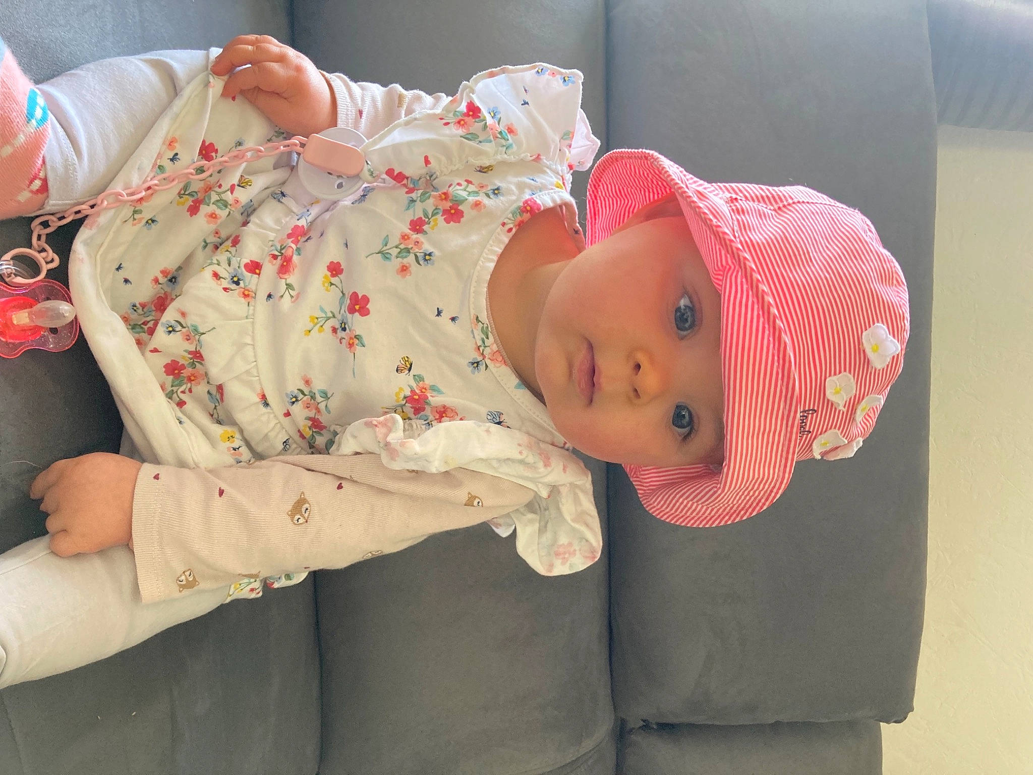 Lina participe au concours pour gagner de l'argent avec cette photo : abdomen, baby, baby_products, baby_toddler_clothing, child, comfort, elbow, hat, headgear, headwear, human_body, linens, nap, pattern, person, pink, room, skin, sleep, sleeve