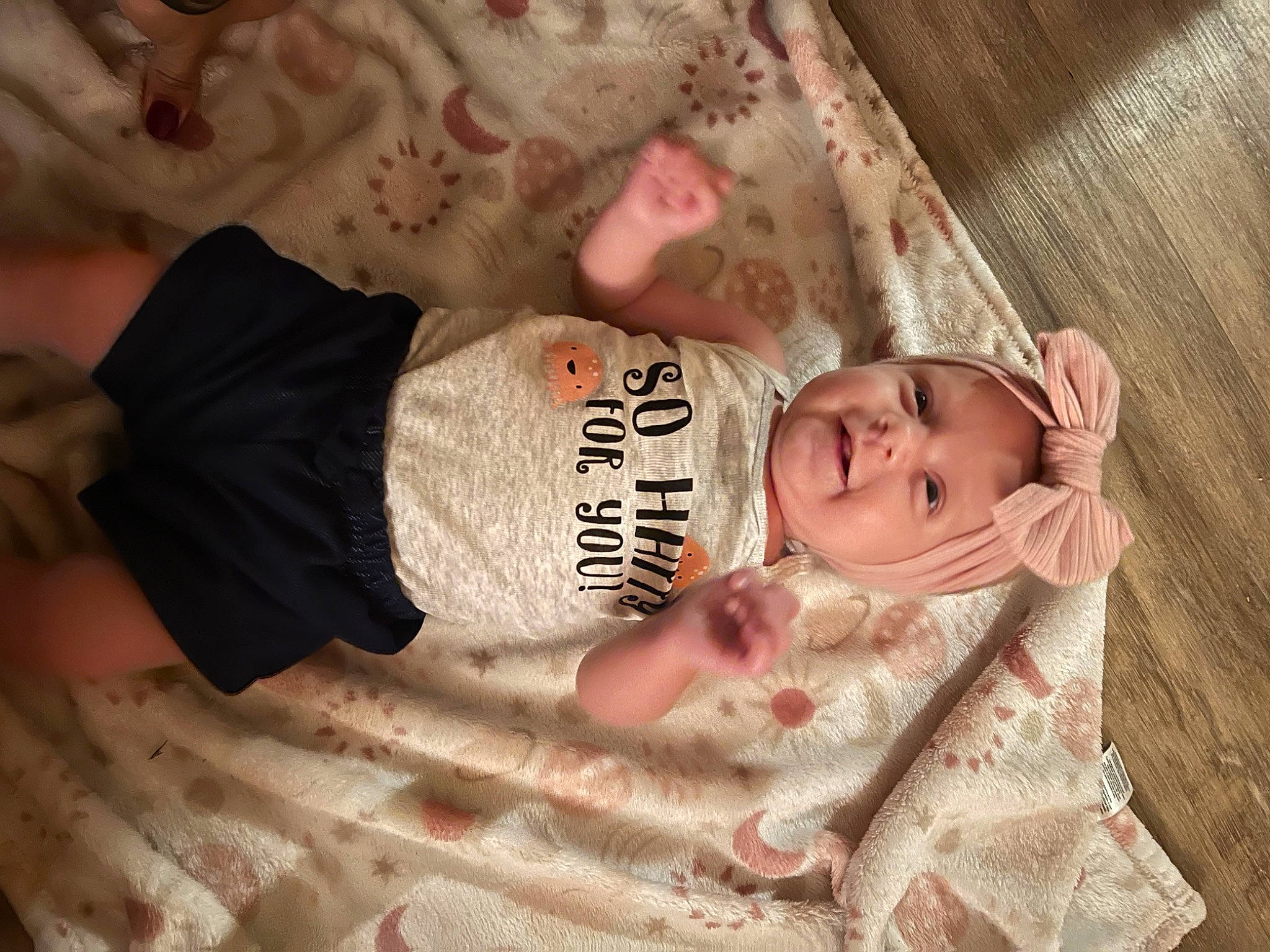 Memphis is registered to the contest to win money with this photo: arm, baby, baby_products, baby_toddler_clothing, cheek, child, chin, comfort, eye, head, headgear, human_body, linens, nose, pattern, person, sitting, skin, sleeve, toddler