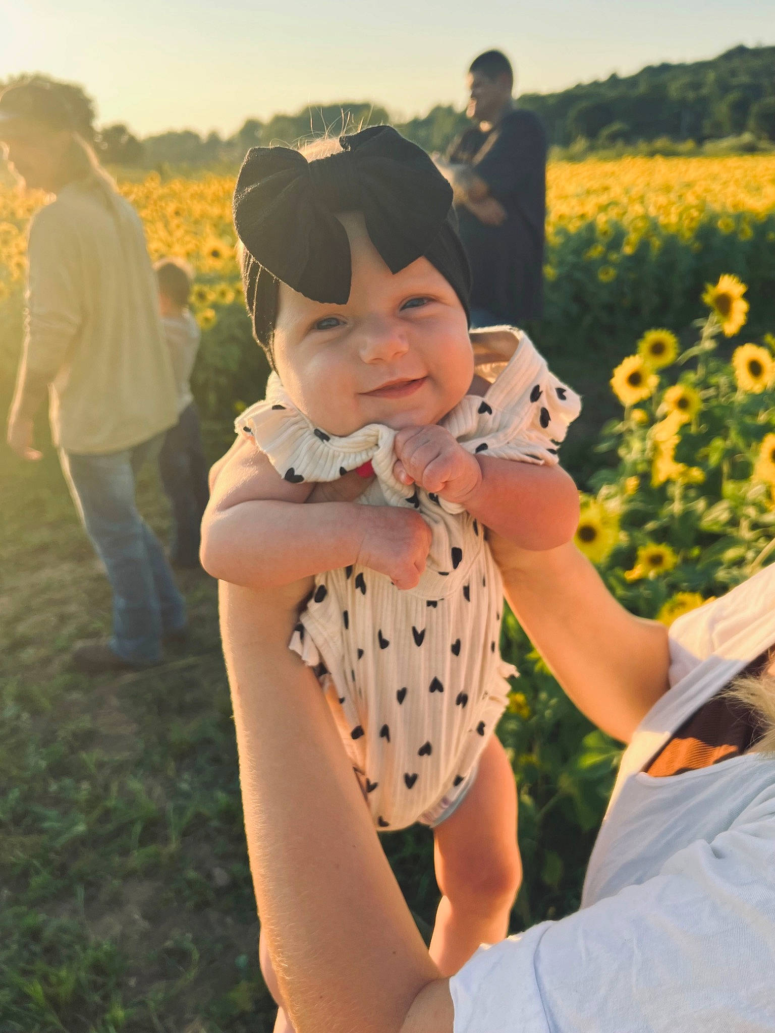 Memphis joined the competition — help win amazing prizes! baby, child, flower, fun, gesture, grass, grassland, happy, hat, headwear, landscape, leisure, people_in_nature, person, plant, recreation, sitting, sky, spring, sun_hat