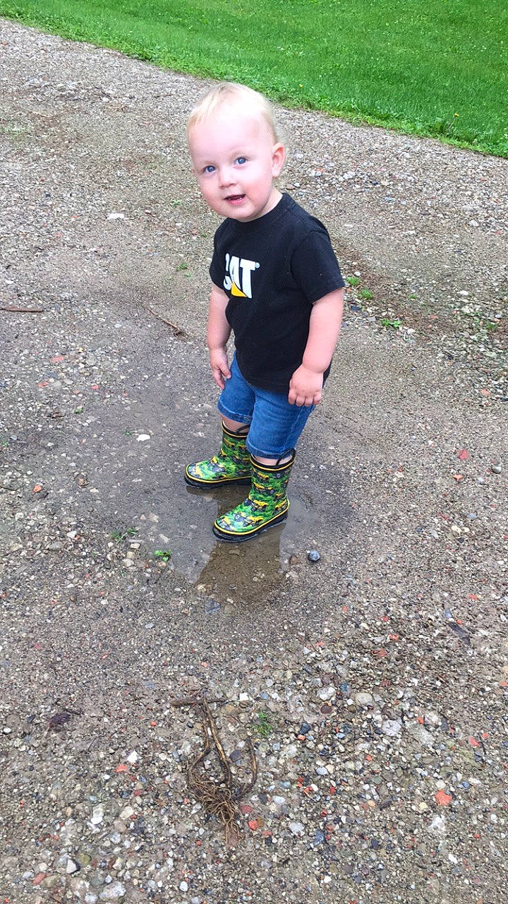 Braxton is registered to the contest to win money with this photo: asphalt, child, footwear, person, play, shoe, soil, toddler