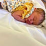 Evalyn joined the competition — help win amazing prizes! newborn, baby, sleeping, infant, blanket, floral, yellow, soft, peaceful, cute, clothing, portrait, resting, child, indoors, closeup, face, skin, head, small