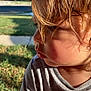 James joined the competition — help win amazing prizes! child, close_up, profile, face, hair, sunlight, shadow, outdoor, grass, sidewalk, expression, portrait, casual_clothing, young, curly_hair, natural_light, skin, head, toddler, daytime
