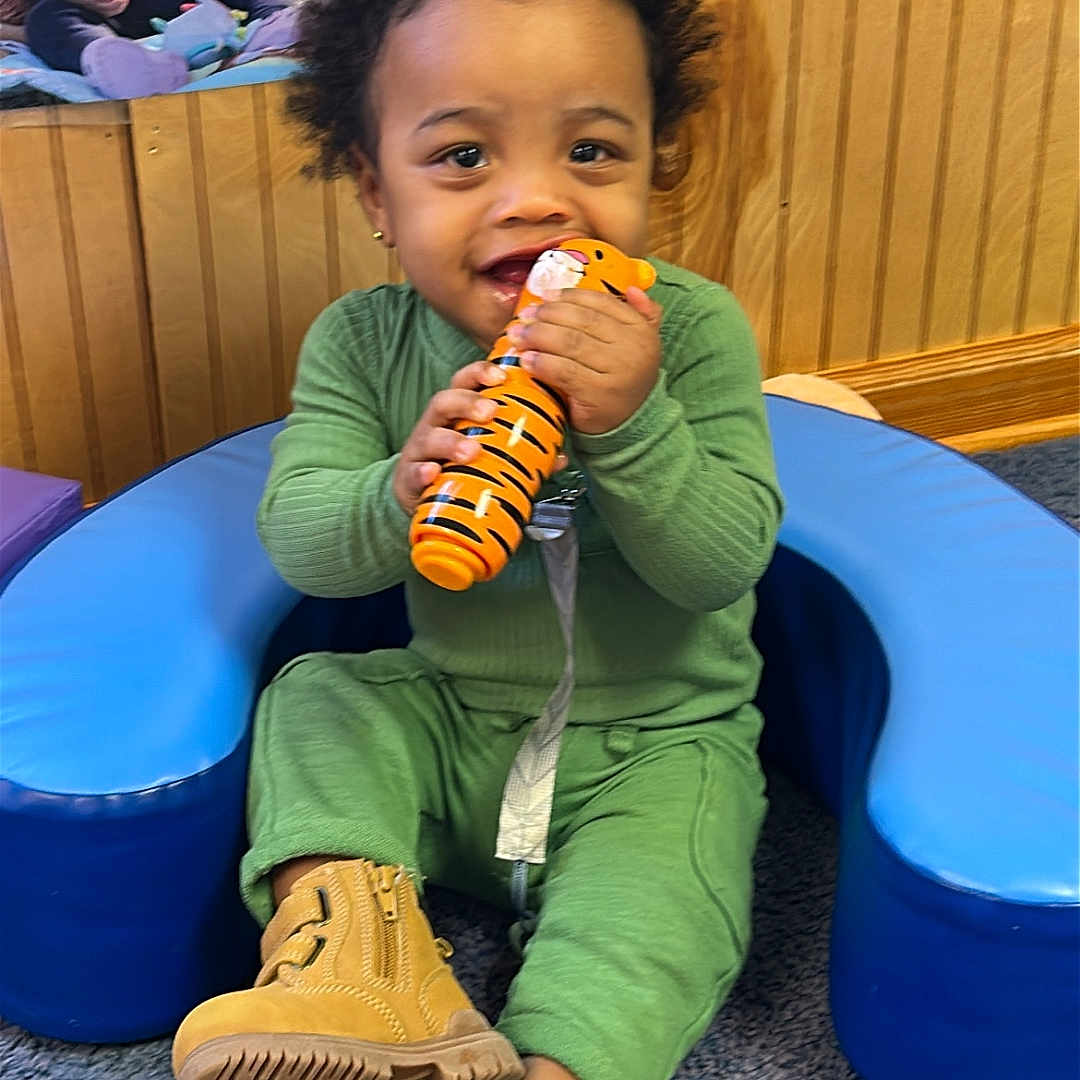 Dreayden joined the competition — help win amazing prizes! baby, background, blue_cushion, boots, carpet, child, cute, face, green_clothing, happy, indoor, people, playtime, sitting, smiling, toddler, toy, window, wood_paneling, yellow_shirt