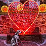architecture, bench, building, cityscape, dalmatian, decoration, dog, evening, heart_shaped_light, holiday_lights, lights, outdoor, park, pavement, pet, seat, spot_pattern, stone_wall, twilight, urban