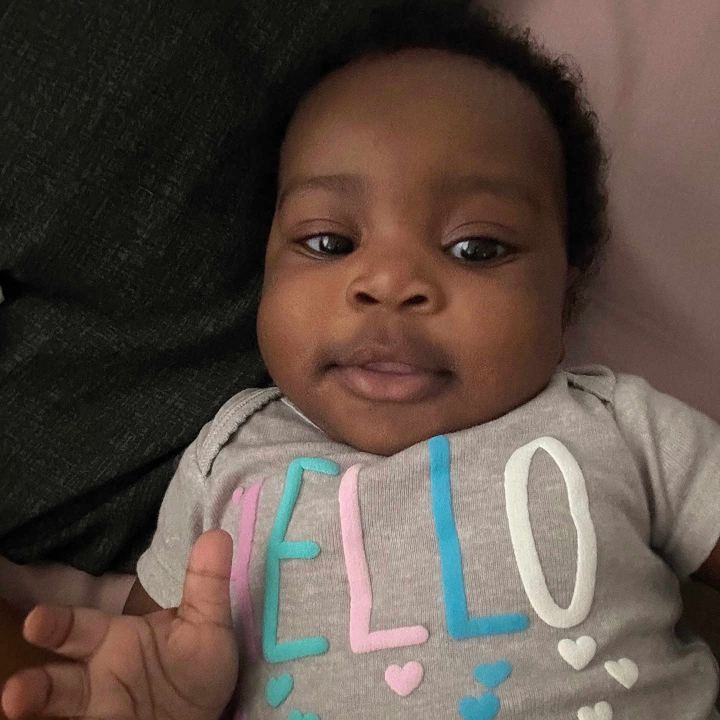 Ivanna joined the competition — help win amazing prizes! baby, casual, child, clothing, cute, expression, face, hand, hearts, indoors, infant, letters, looking, lying_down, person, portrait, shirt, skin, soft, young