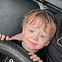 Abel-James joined the competition — help win amazing prizes! child, smiling, blue_eyes, blonde_hair, black_shirt, steering_wheel, hand, person, vehicle_interior, seat, adult_arm, casual_clothing, portrait, cute, happy, young_child, indoor, closeup, face, holding