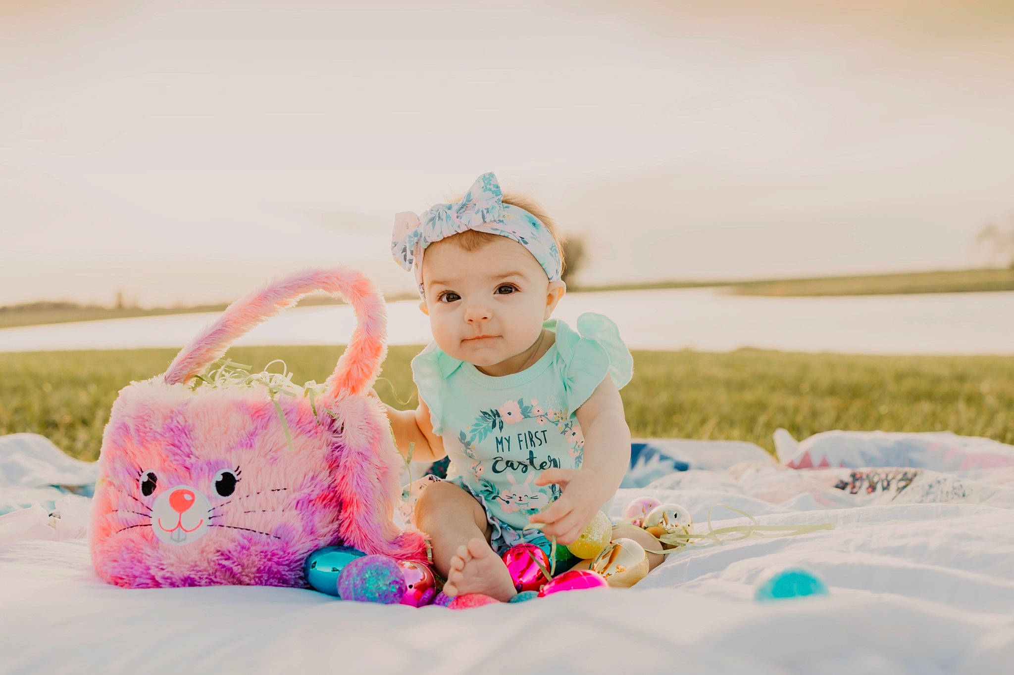Fallon joined the competition — help win amazing prizes! baby, baby_toddler_clothing, child, fun, grass, happy, headwear, leisure, linens, magenta, pattern, people_in_nature, person, pink, recreation, sitting, skin, sky, sleeve, sweetness