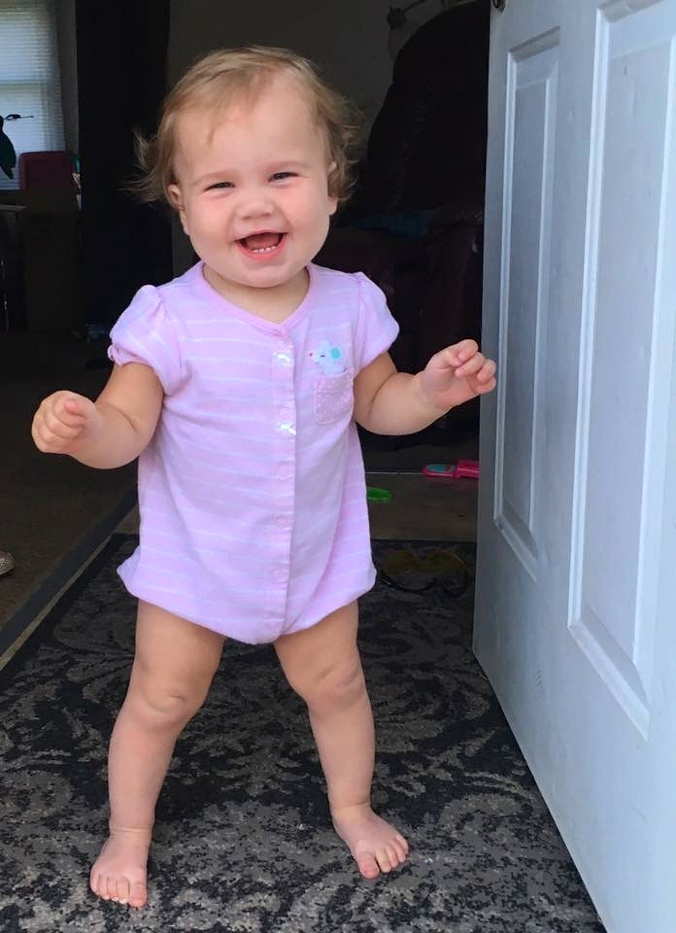 Willow Marie is registered to the contest to win money with this photo: arm, child, day, finger, fun, girl, hand, infant, joy, leg, person, pink, play, product, shorts, shoulder, sitting, skin, smile, standing