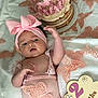 Kaylee joined the competition — help win amazing prizes! baby, infant, 2_months, headband, bow, butterfly, cake, blanket, pink, peach, celebration, cute, soft, clothing, portrait, child, laying, decor, closeup, happy