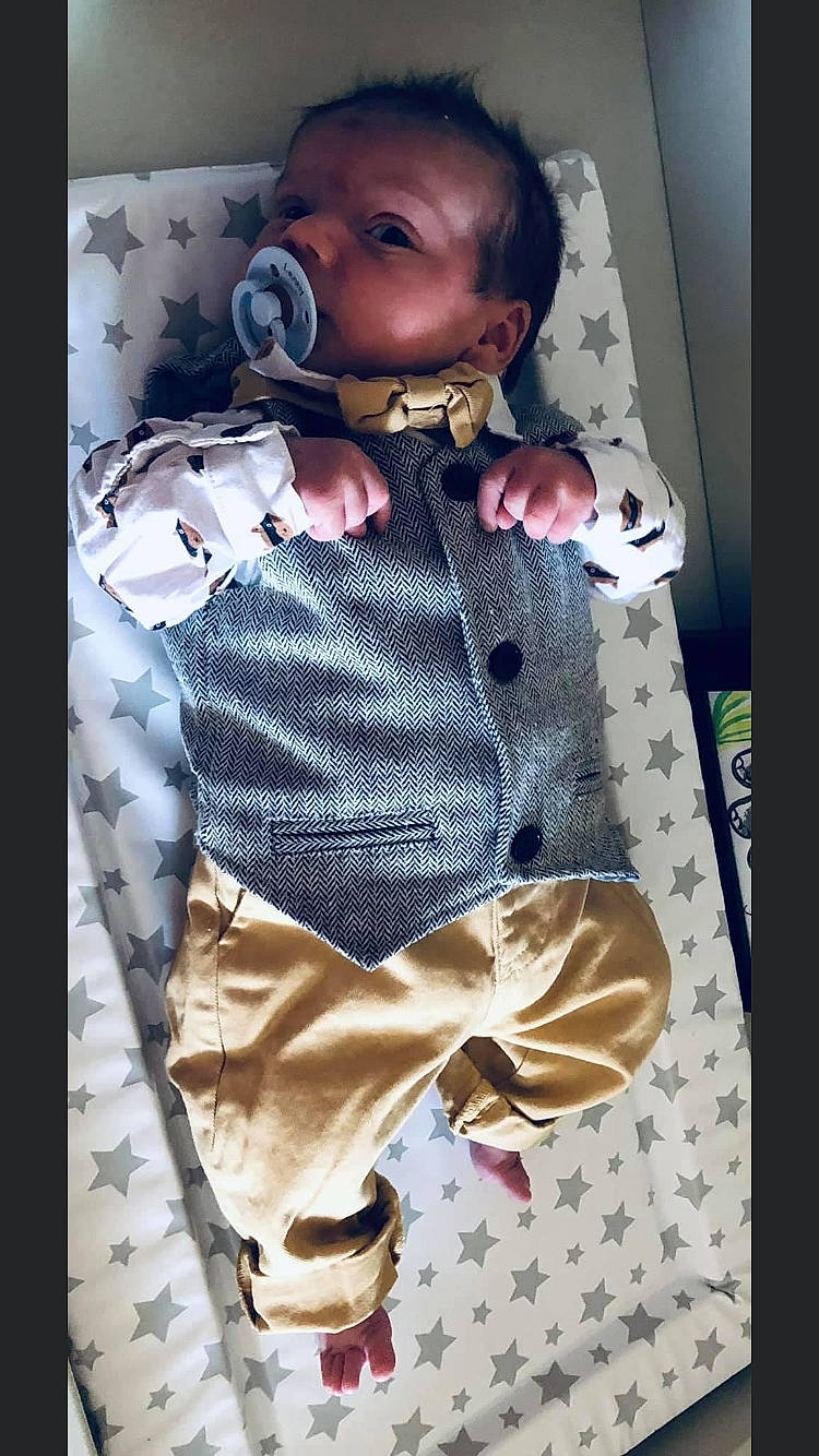 Lenny is registered to the contest to win money with this photo: baby, baby_toddler_clothing, bow_tie, collar, doll, dress_shirt, fashion, fashion_design, formal_wear, linens, neck, outerwear, person, pink, plaid, product, skin, sleeve, toddler, toy