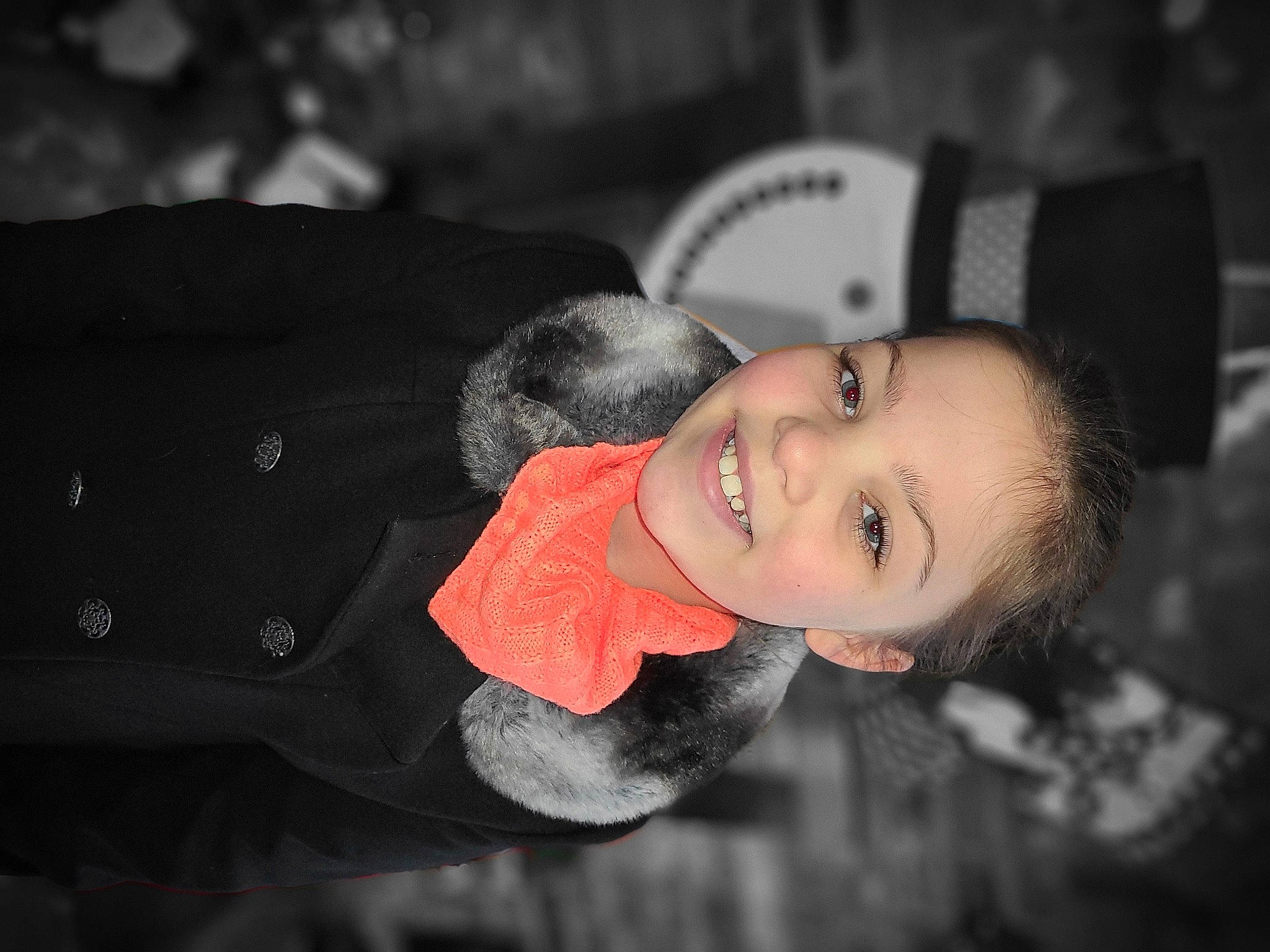 Lorelai is registered to the contest to win money with this photo: black_hair, child, event, flash_photography, formal_wear, fun, happy, jewellery, joy, laugh, person, portrait_photography, sitting, smile, toddler, tradition, tree, winter