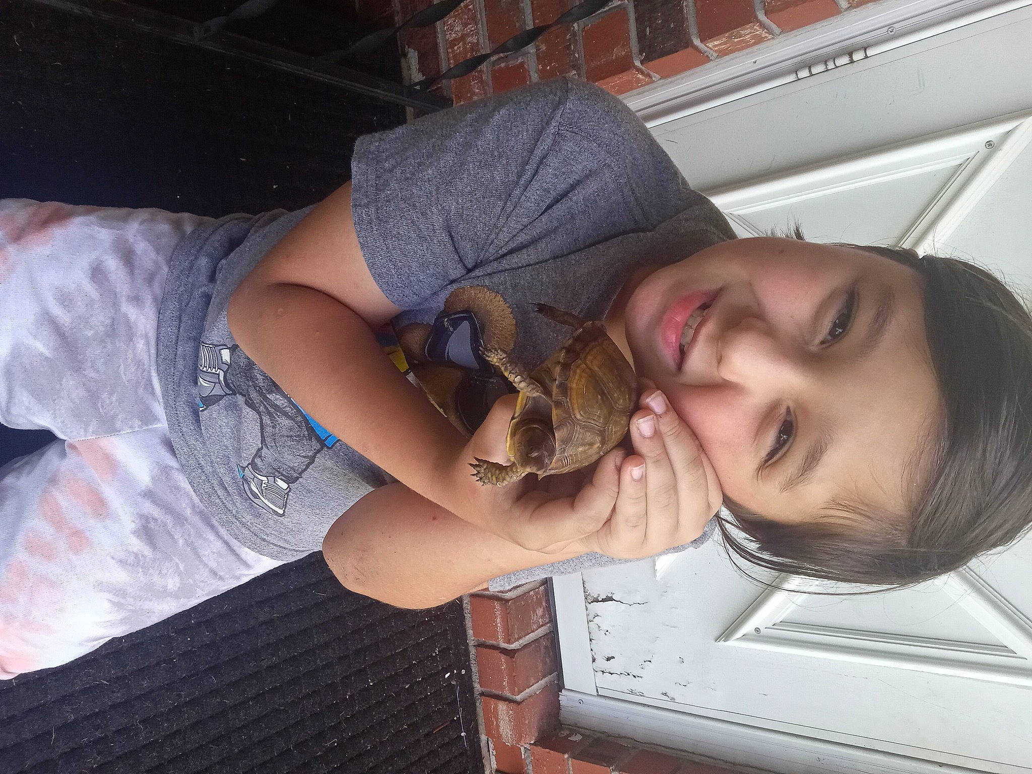 Gavyn is registered to the contest to win money with this photo: elbow, eyewear, fawn, flash_photography, fun, fur, happy, hat, human_leg, joy, knee, long_hair, pattern, person, reptile, scaled_reptile, smile, snake, sunglasses, thigh