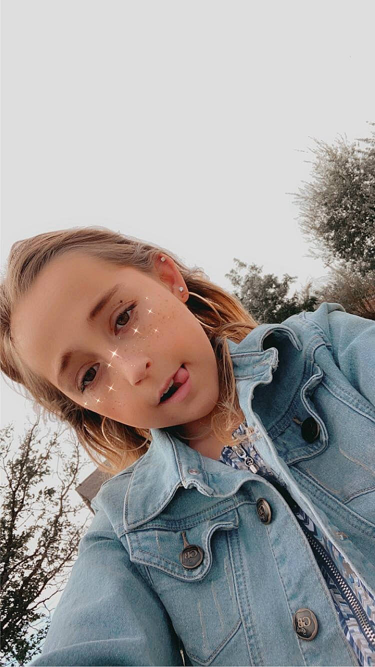 Julie joined the competition — help win amazing prizes! cool, eyebrow, eyelash, flash_photography, grass, happy, iris, lip, mammal, mouth, neck, nose, outerwear, people_in_nature, person, shoulder, skin, sky, smile, sunlight