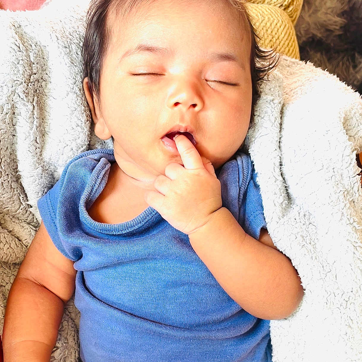 Sri Vamika is registered to the contest to win money with this photo: baby, blanket, blue_shirt, child, cozy, cushion, cute, diaper, finger_in_mouth, hair, hand, indoors, infant, peaceful, portrait, relax, resting, skin, sleeping, soft_texture