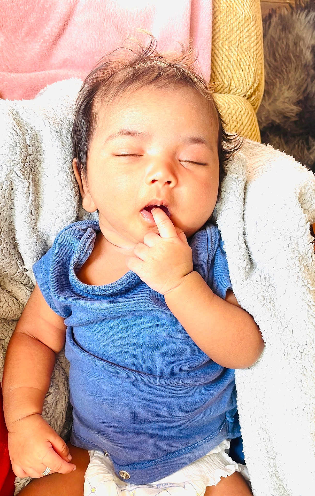 Sri Vamika is registered to the contest to win money with this photo: baby, sleeping, finger_in_mouth, blue_shirt, diaper, blanket, cushion, soft_texture, infant, peaceful, cute, child, indoors, resting, cozy, portrait, skin, hair, hand, relax