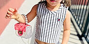 Leah joined the competition — help win amazing prizes! bracelet, child, cute, fashion, handbag, outdoor, person, portrait, posing, railing, shoes, sidewalk, skirt, sneakers, striped_clothing, sunglasses, sunny, toddler, top, young