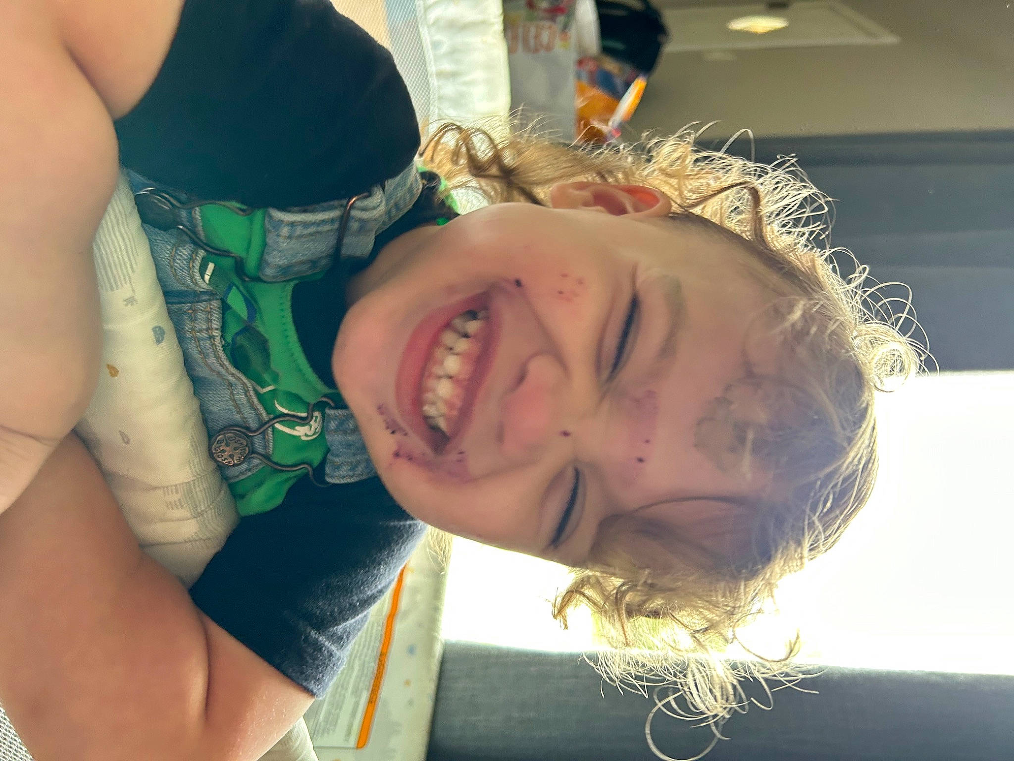 Bellamy is registered to the contest to win money with this photo: arm, chest, elbow, eyelash, eyewear, gesture, grass, happy, jaw, joy, leisure, long_hair, mouth, neck, nose, person, plant, shoulder, skin, smile