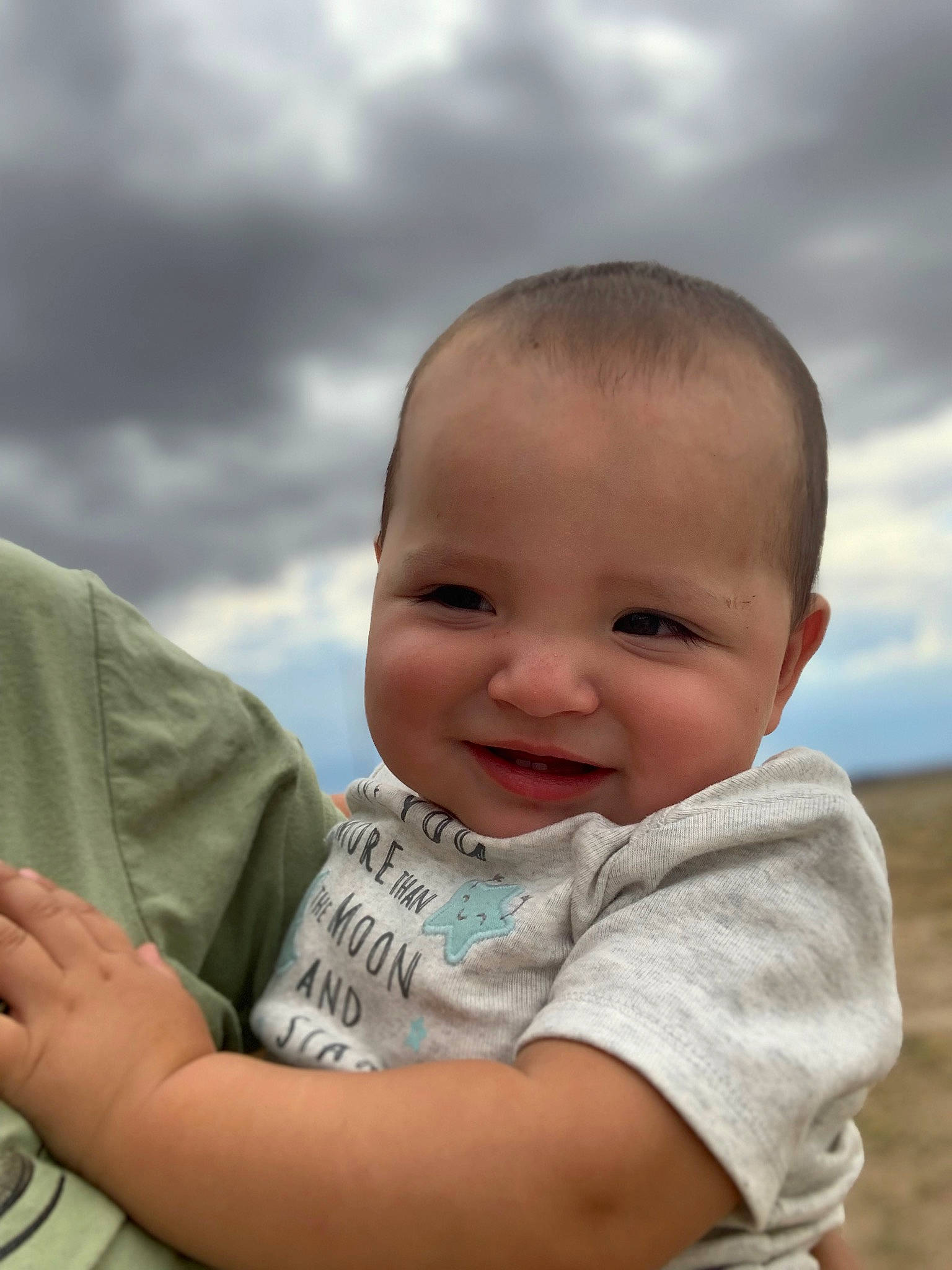 Gael is registered to the contest to win money with this photo: baby, baby_toddler_clothing, cheek, chin, cloud, facial_expression, flash_photography, fun, gesture, grass, happy, iris, joy, nose, people_in_nature, person, skin, sky, smile, standing