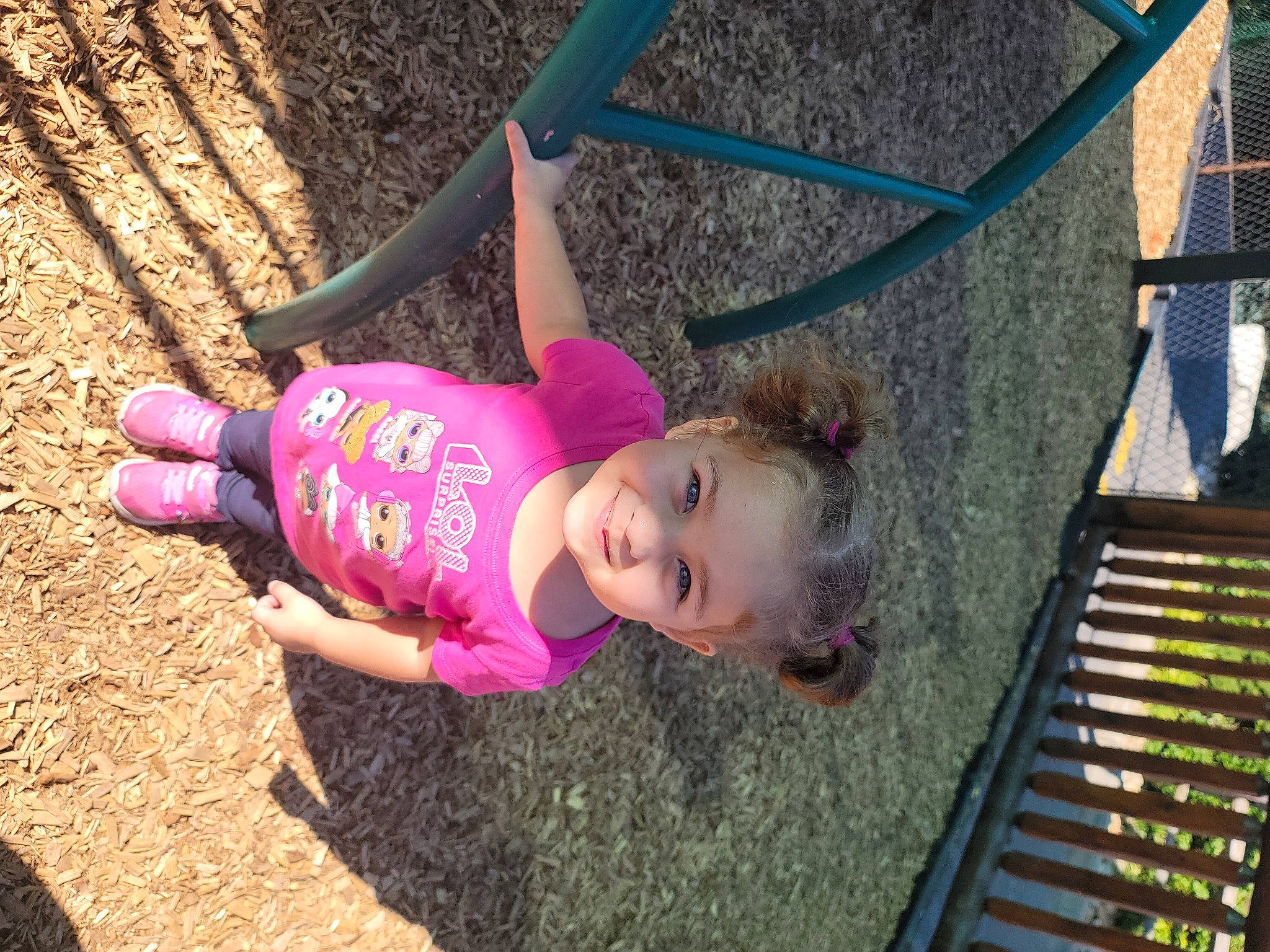 Mercedes is registered to the contest to win money with this photo: baby, baby_toddler_clothing, child, happy, human_settlement, joy, outdoor_play_equipment, people_in_nature, person, pink, play, playground, public_space, purple, shadow, soil, toddler