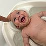 baby, bath, water, smile, happy, child, skin, head, hand, necklace, infant, cute, playful, splash, indoors, tub, wet, person, closeup, joy