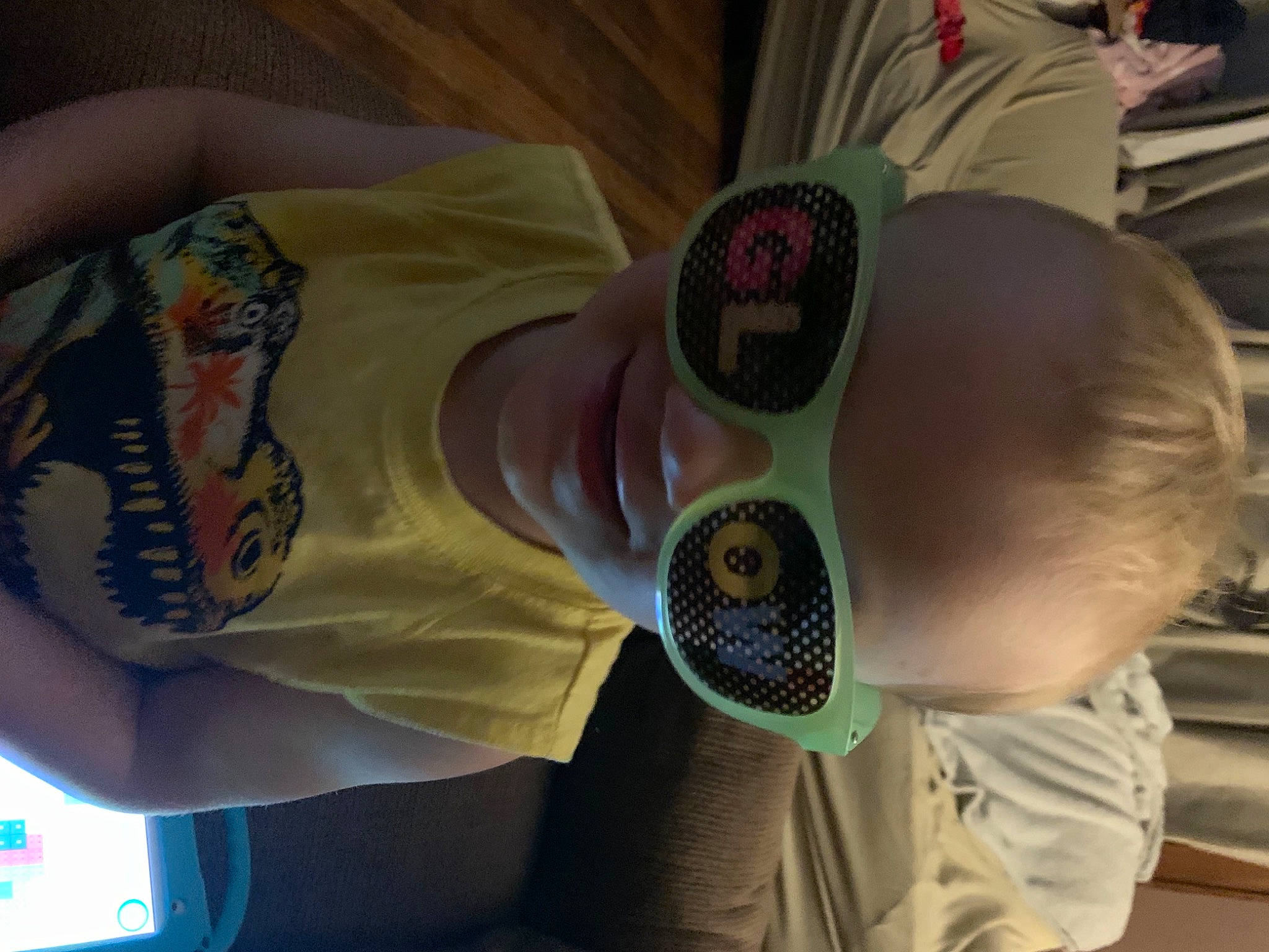 Clark is registered to the contest to win money with this photo: baby, baby_toddler_clothing, child, comfort, cool, elbow, eyewear, finger, fun, joint, mouth, pattern, person, personal_protective_equipment, product, skin, sleeve, t_shirt, toddler, wrist