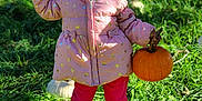 Moriah joined the competition — help win amazing prizes! child, girl, pumpkin, pumpkin_patch, pink_jacket, pink_pants, grass, outdoor, fall, autumn, smiling, shoes, nature, greenery, sunlight, holding, standing, cute, happy, holiday