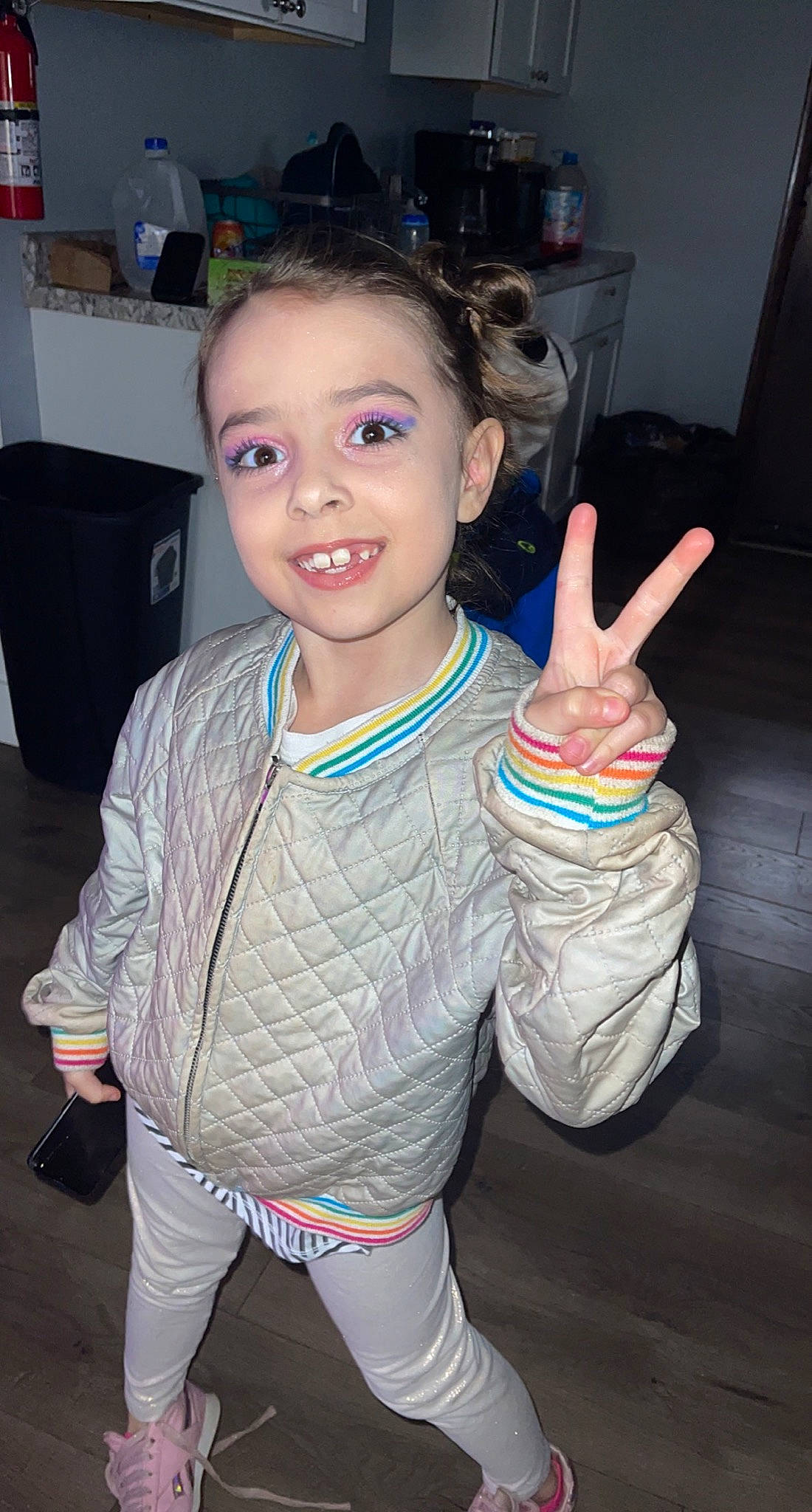 Addilynn joined the competition — help win amazing prizes! chair, chest, child, event, finger, fun, gesture, hand, happy, joy, okay, organ, person, sign_language, sleeve, smile, standing, t_shirt, thumb, toddler