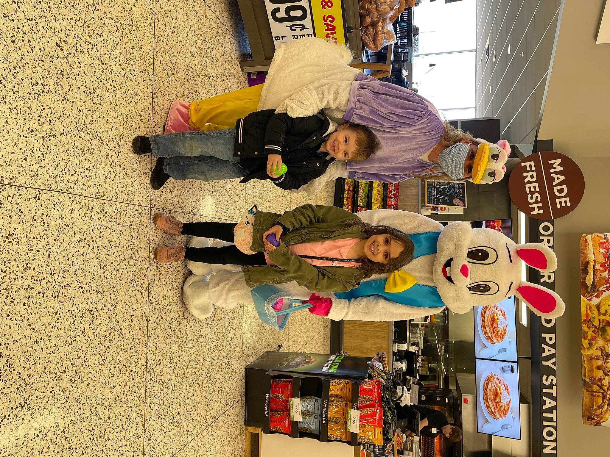 Addilynn is registered to the contest to win money with this photo: bottle, clothing, collection, flooring, joy, person, room, shelving, t_shirt, walking_shoe