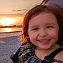 Naé participe au concours pour gagner de l'argent avec cette photo : child, clothing, evening, face, hair, happy, landscape, leisure, nature, outdoor, person, playful, portrait, sky, smiling, stroller, sunlight, sunset, water, young