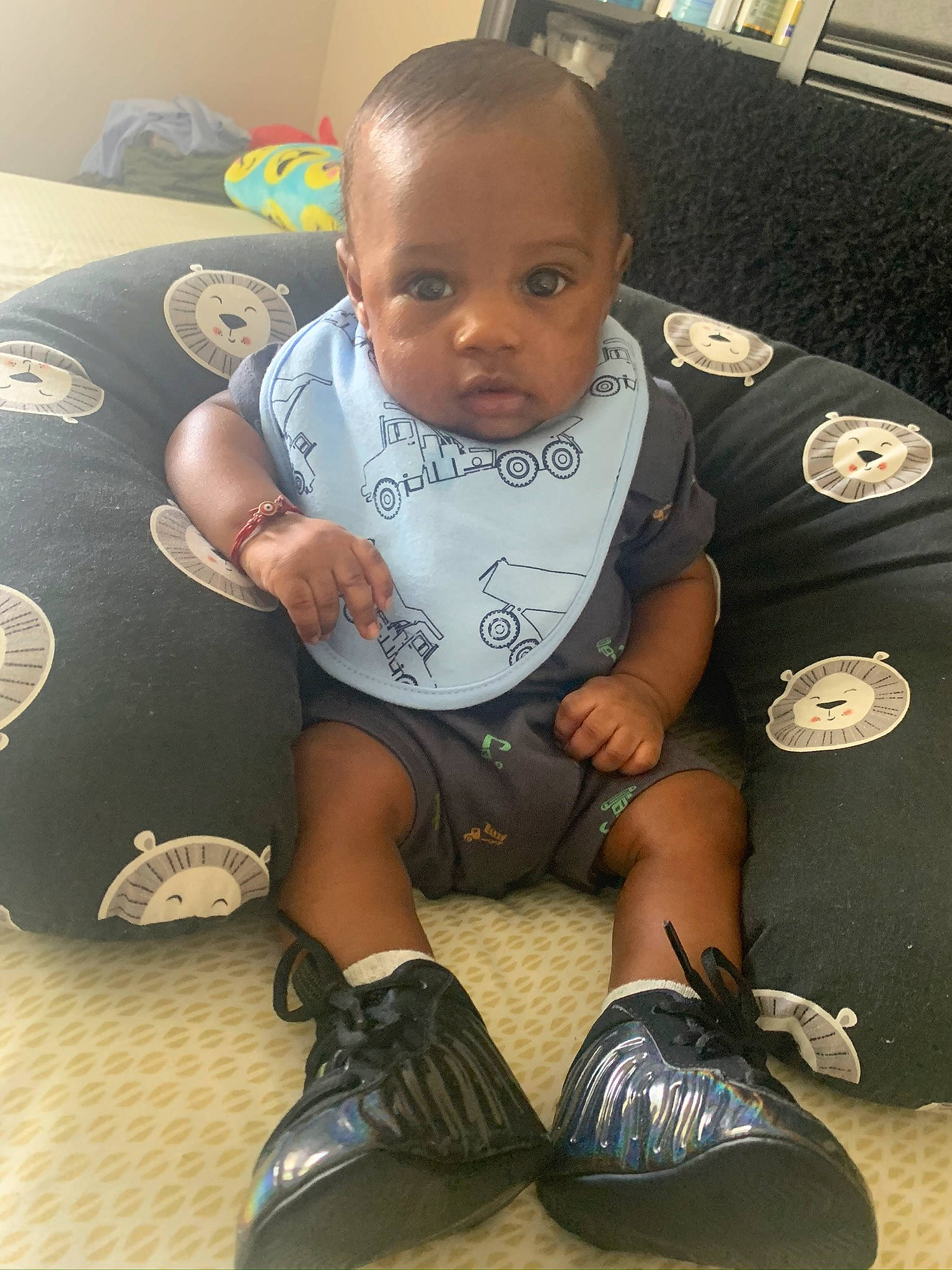 Kenny joined the competition — help win amazing prizes! baby, baby_products, baby_toddler_clothing, bed, bib, button, child, ear, leather, linens, person, sitting, sock, toddler, walking_shoe