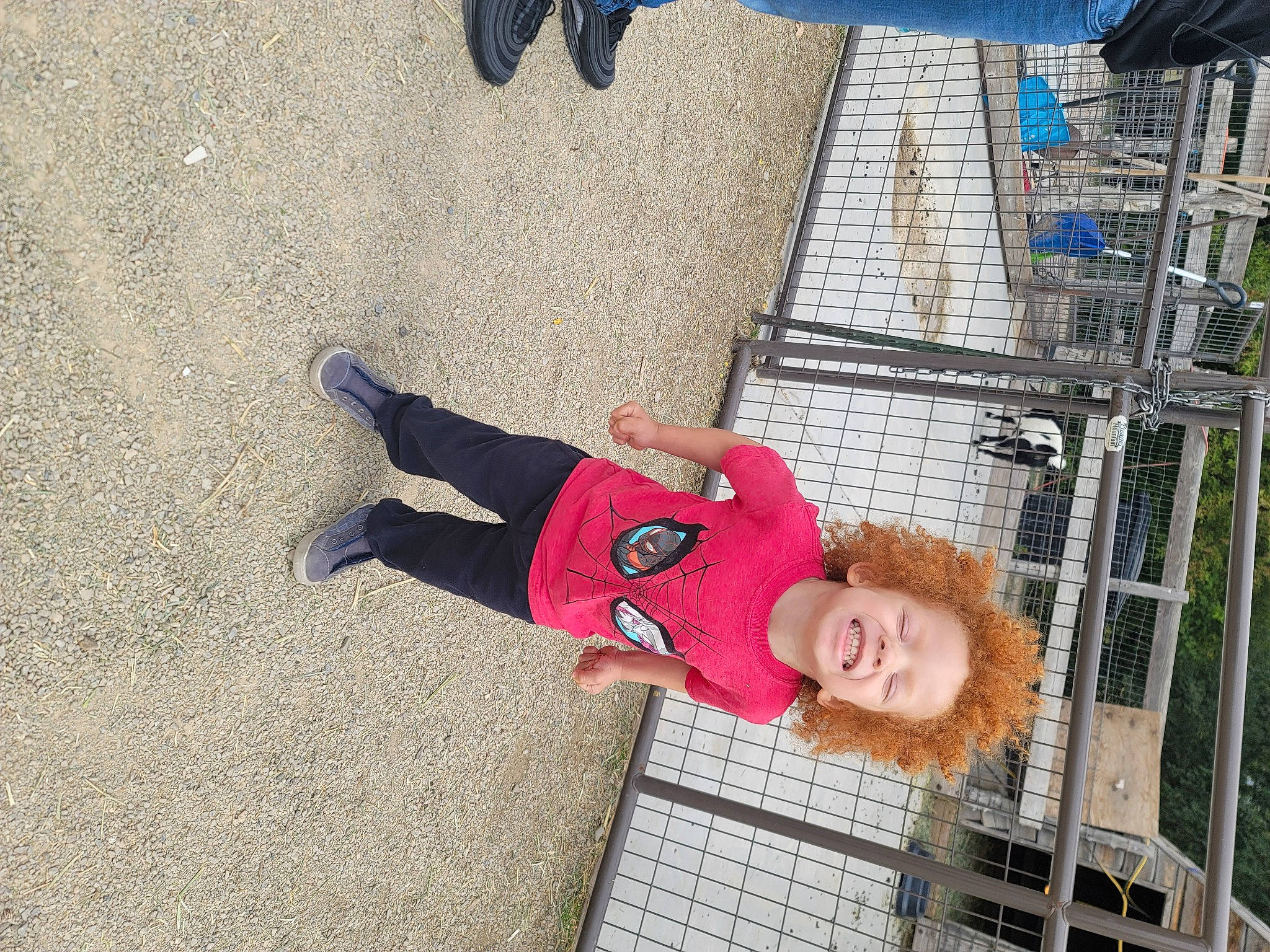 Andre is registered to the contest to win money with this photo: blue, child, city, concrete, foot, fun, happy, human_leg, joy, leisure, mesh, person, play, recreation, road_surface, shadow, sidewalk, smile, toddler, travel