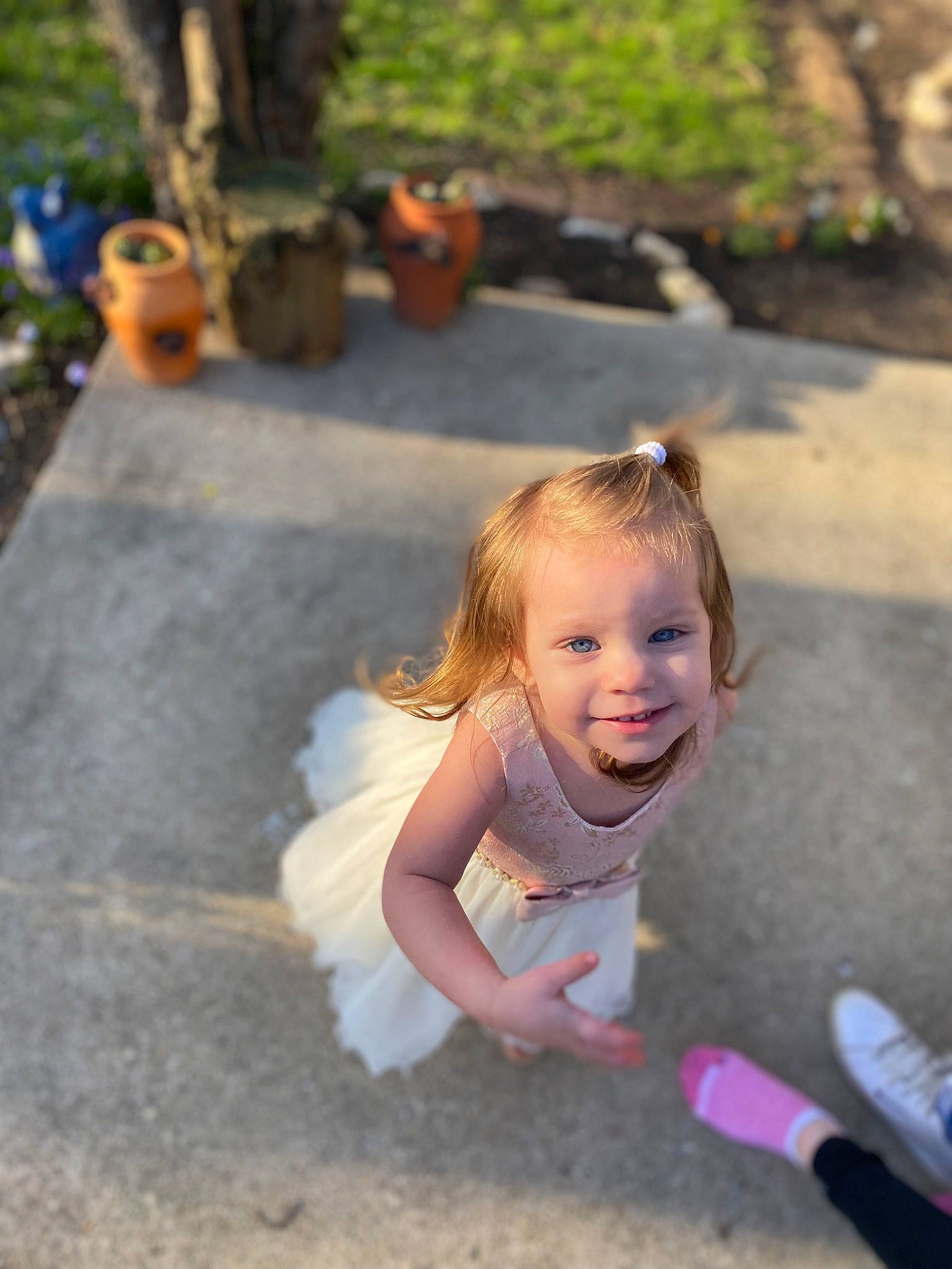 Annalise is registered to the contest to win money with this photo: asphalt, calabaza, child, fun, grass, happy, joy, landscape, leisure, people_in_nature, person, plant, pumpkin, recreation, road, road_surface, sitting, smile, soil, summer